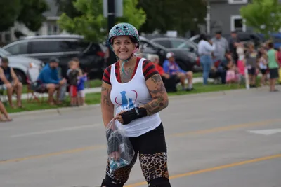 A roller skater hands out candy during the Fourth of July parade in Brookings, South Dakota.
